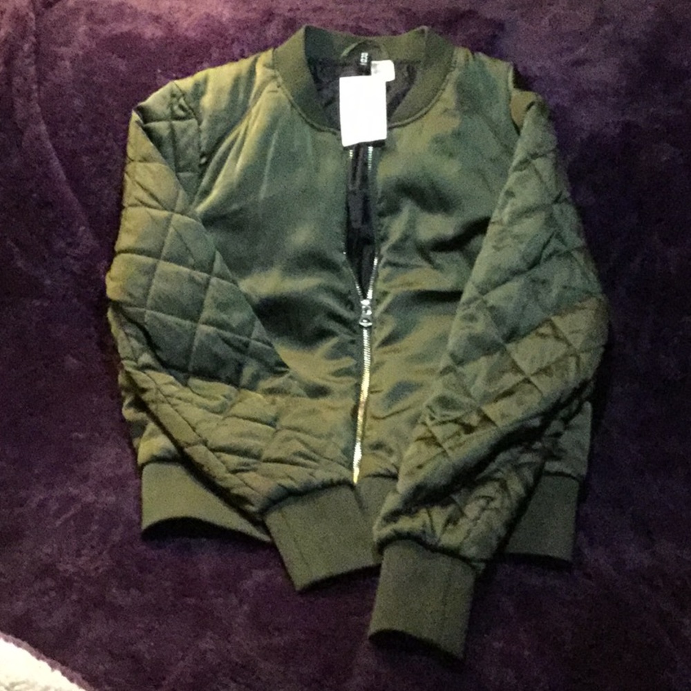 Green bomber style jacket with quilted sleeves